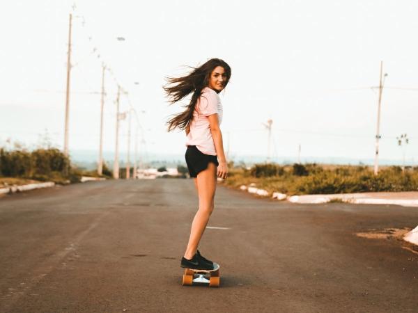 Girl on a skateboard.