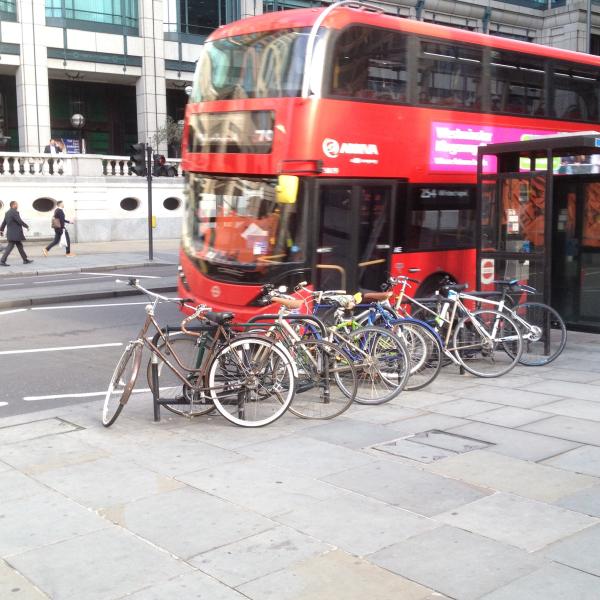 Bicycles parked by a bus.