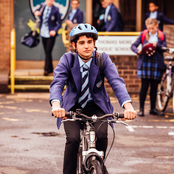 Boy cycling to school.